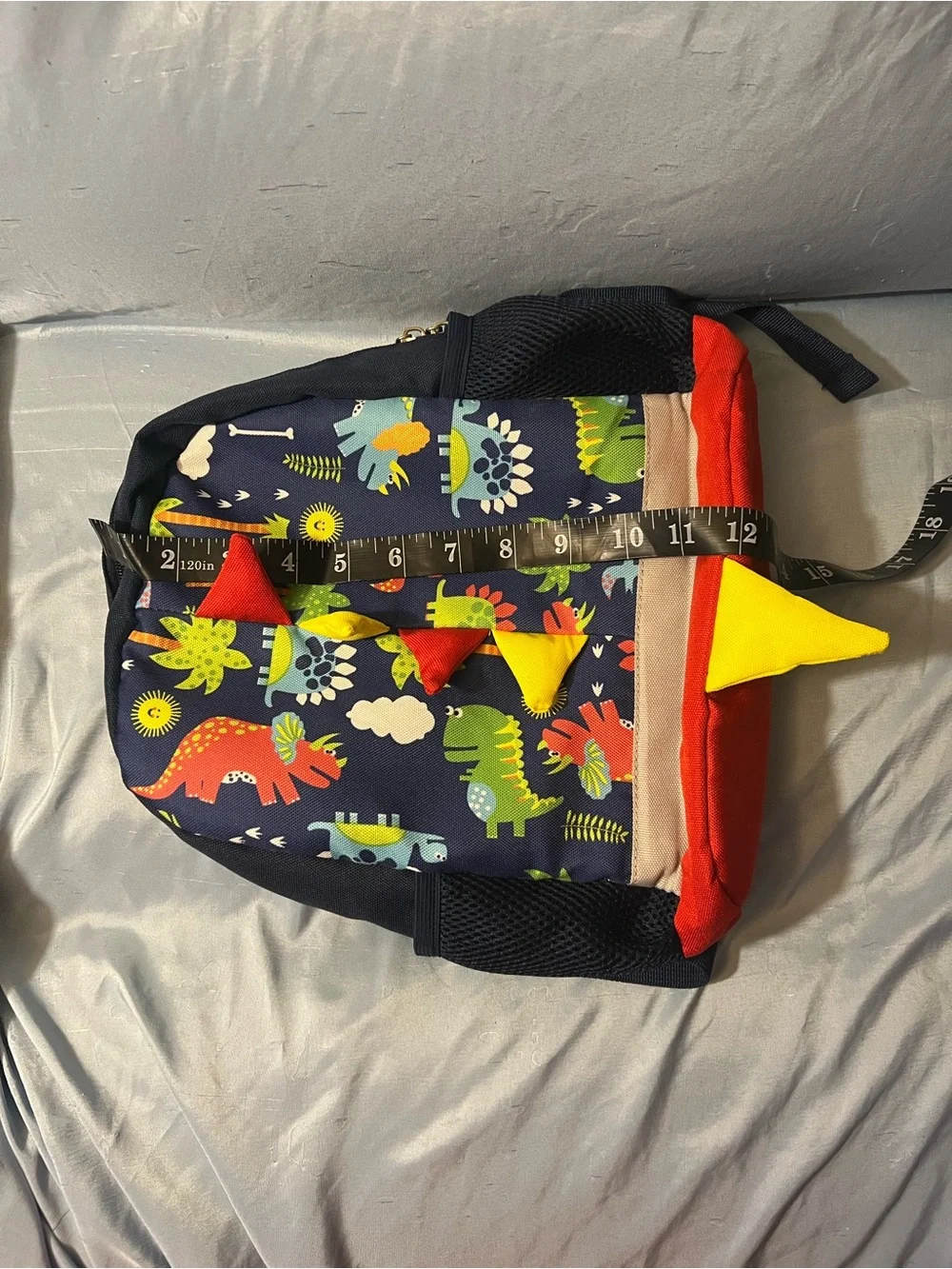 Kids Dinosaur Print Navy Backpack with Red & Yellow Accents